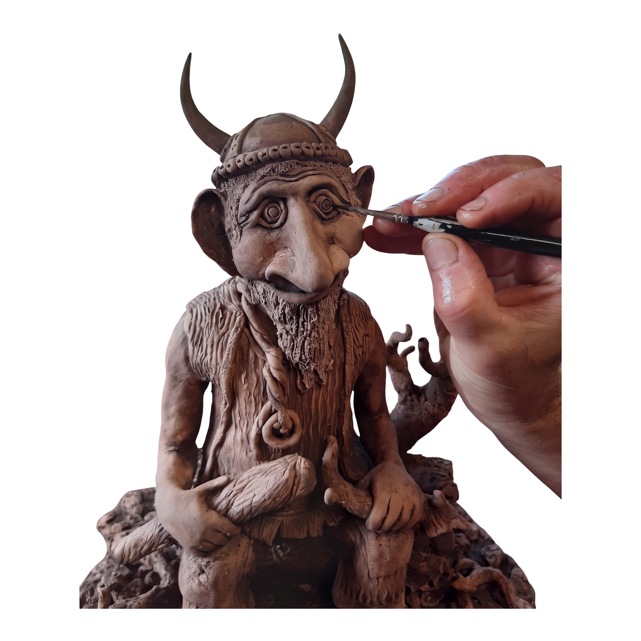 The finished hand-modelled Viking sculpture with horned helmet.